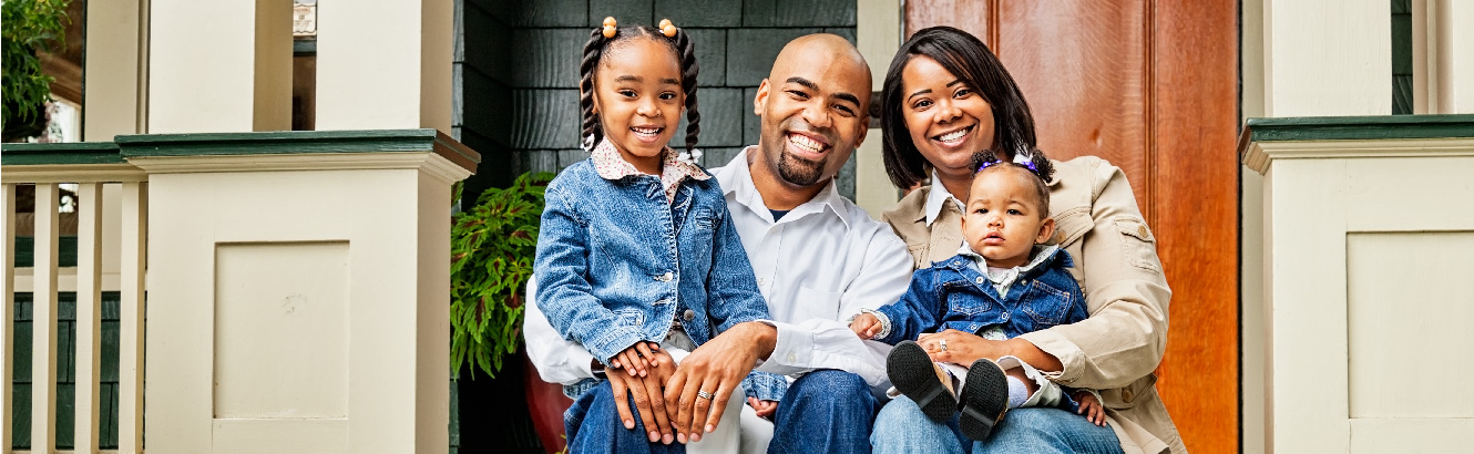 family sitting on porch